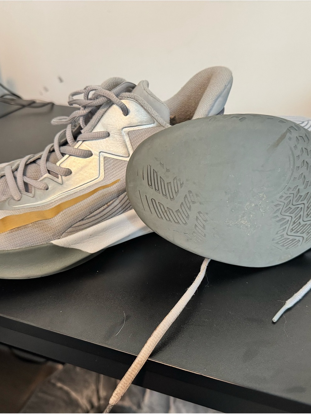 Nike Light Gray Sneakers with Metallic Gold Accent